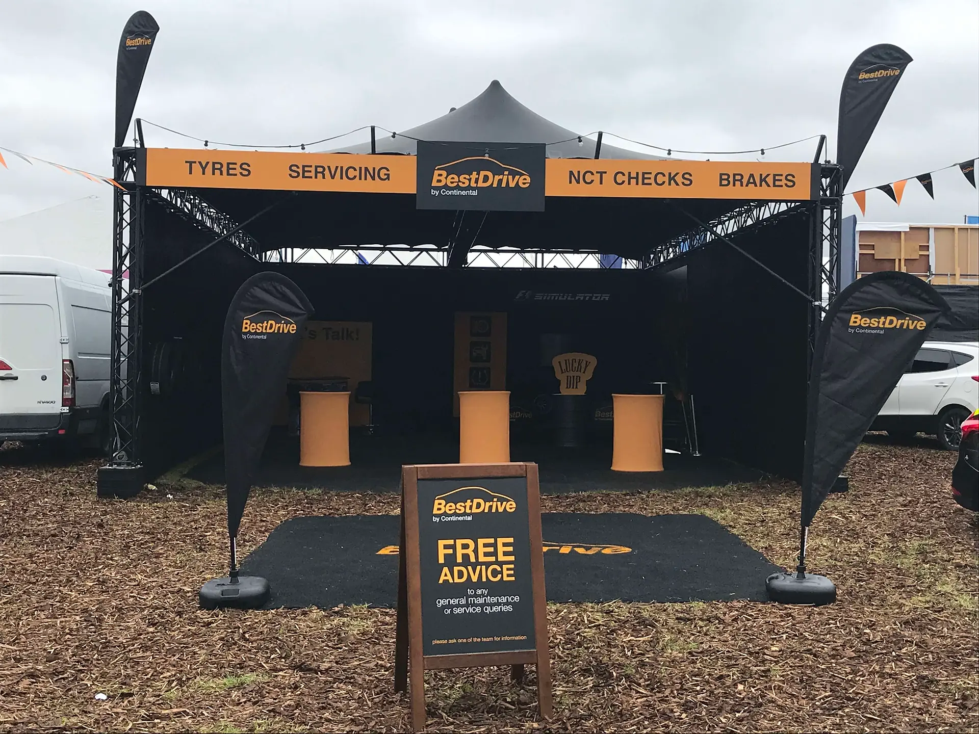gazebo at a trade show for Best Drive, black and orange