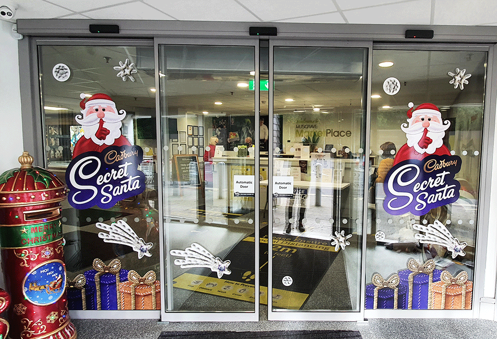 glass doors with christmas signage