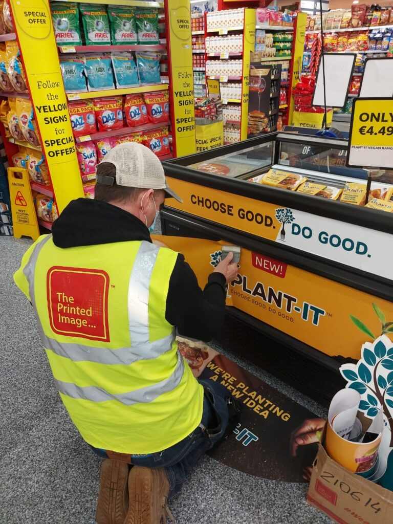 signage on a supermarket freezer, yellow white and blue